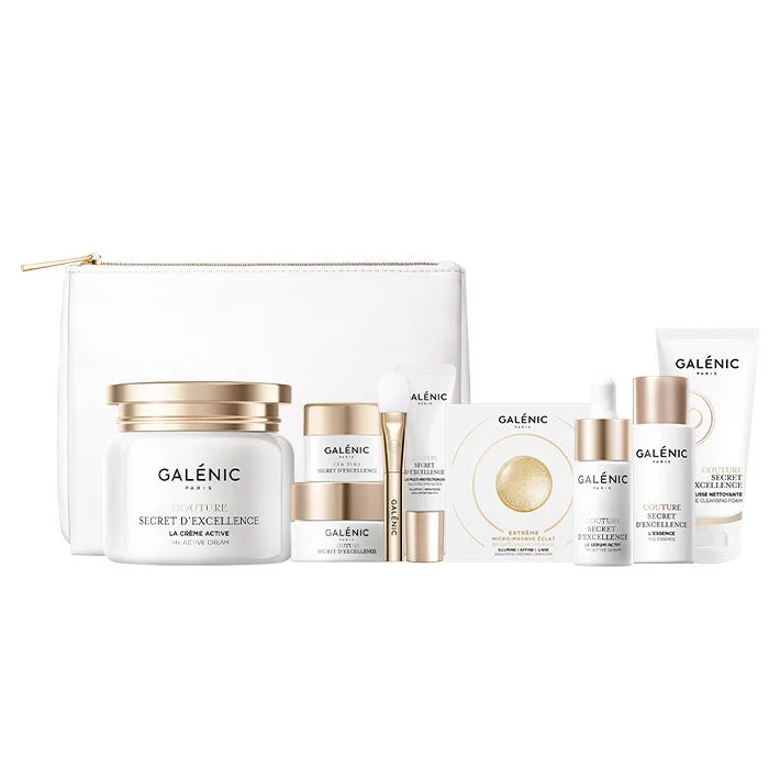 白い背景に、GALÉNIC(ガレニック)のスキンケア製品セットが並べられています。白いポーチと、クリーム、美容液、クレンジングフォームなどが入った、白とゴールドを基調とした高級感のある化粧品が複数写っています。