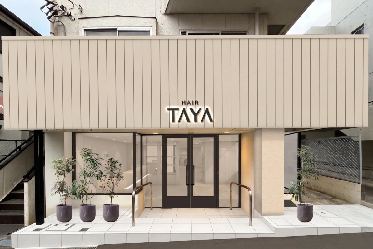 「HAIR TAYA」と書かれたヘアサロンのモダンな店舗外観