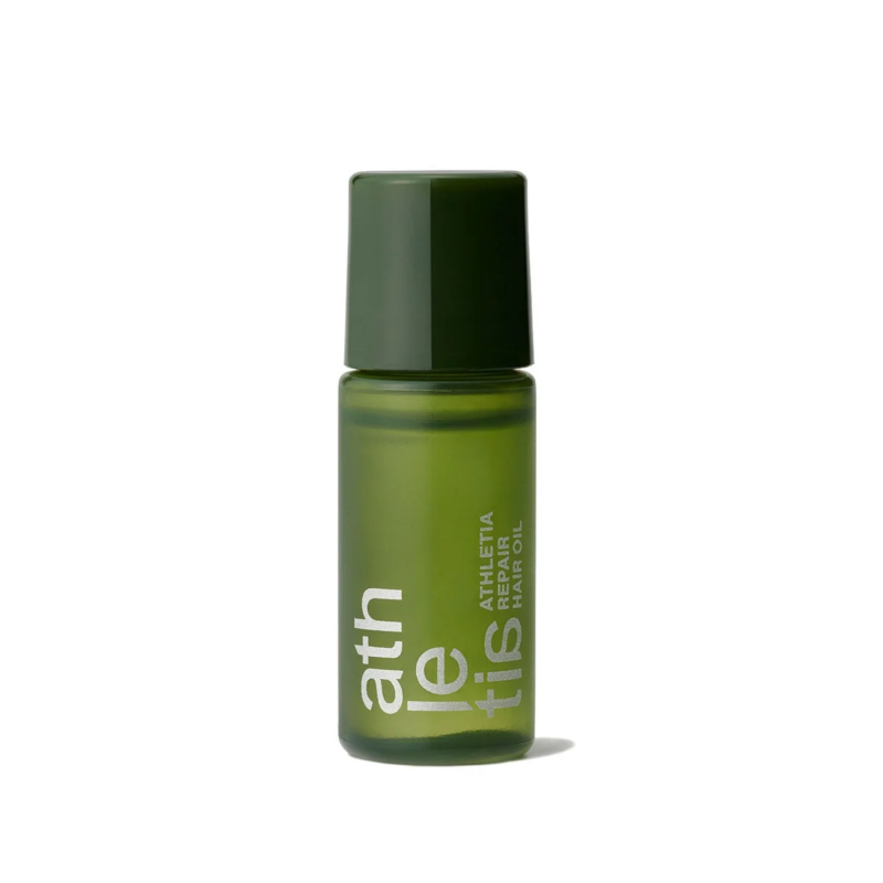 深緑色のキャップと半透明の緑色のボトルが特徴の「athletis REPAIR HAIR OIL」