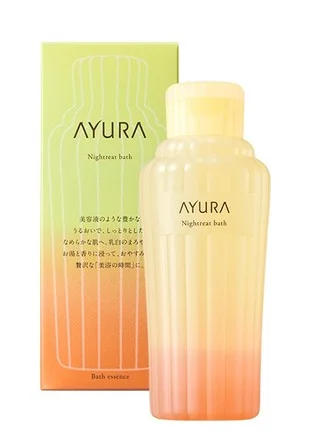 The bottle and package of AYURA's 'Night Treat Bath' bath product. It is described as moisturizing like a serum, offering a luxurious beauty bath with warm water and fragrance.