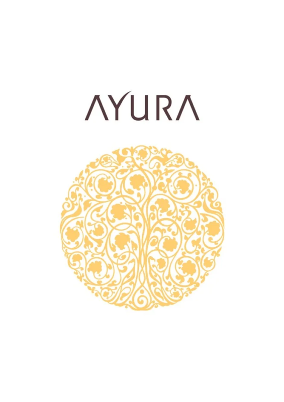 An image with the 'AYURA' logo on a white background and, below it, a circular ornament with delicate golden plant vines and flowers. It gives a simple yet refined, elegant impression.