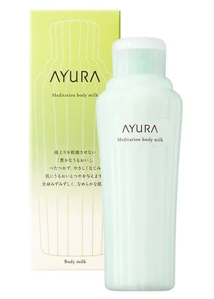 The bottle and box of AYURA's Meditation Body Milk. This body care product keeps skin from drying out after bathing, giving it rich moisture and leaving the whole body dewy and smooth.