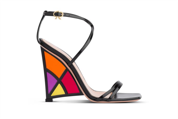 Black sandals with stained-glass-style orange, red, purple and yellow on the heel