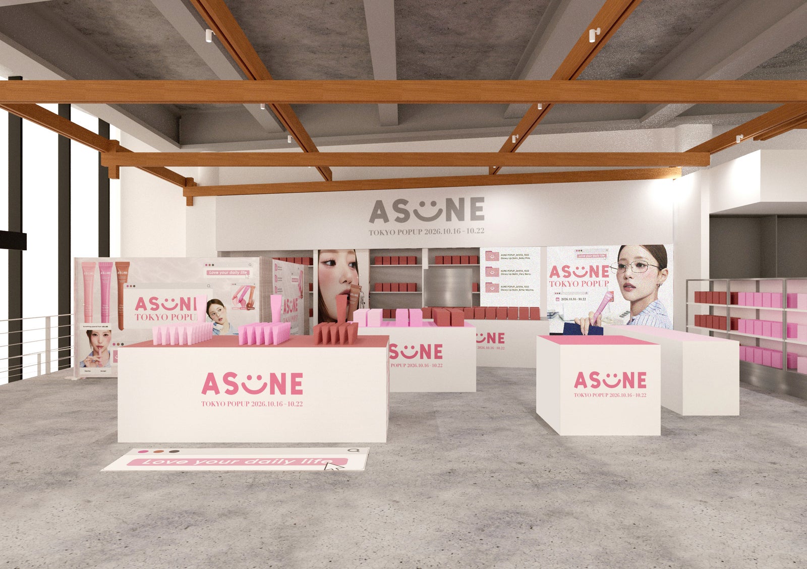 「ASUNE」のロゴを掲げた、白い什器とピンクの装飾が並ぶPOP UP STOREのイメージ
