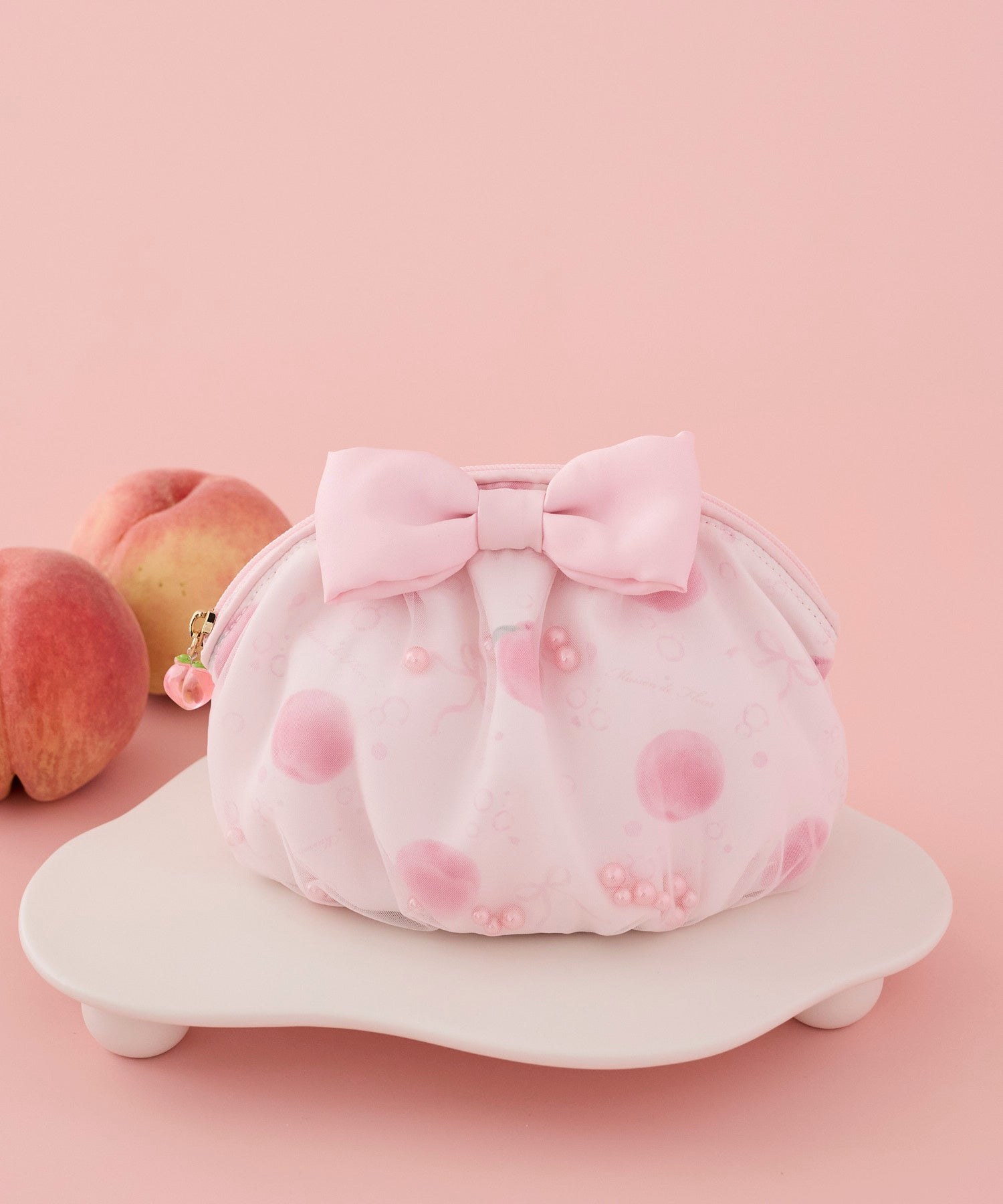 大きなリボンをあしらったピーチスパークリング柄ポーチ