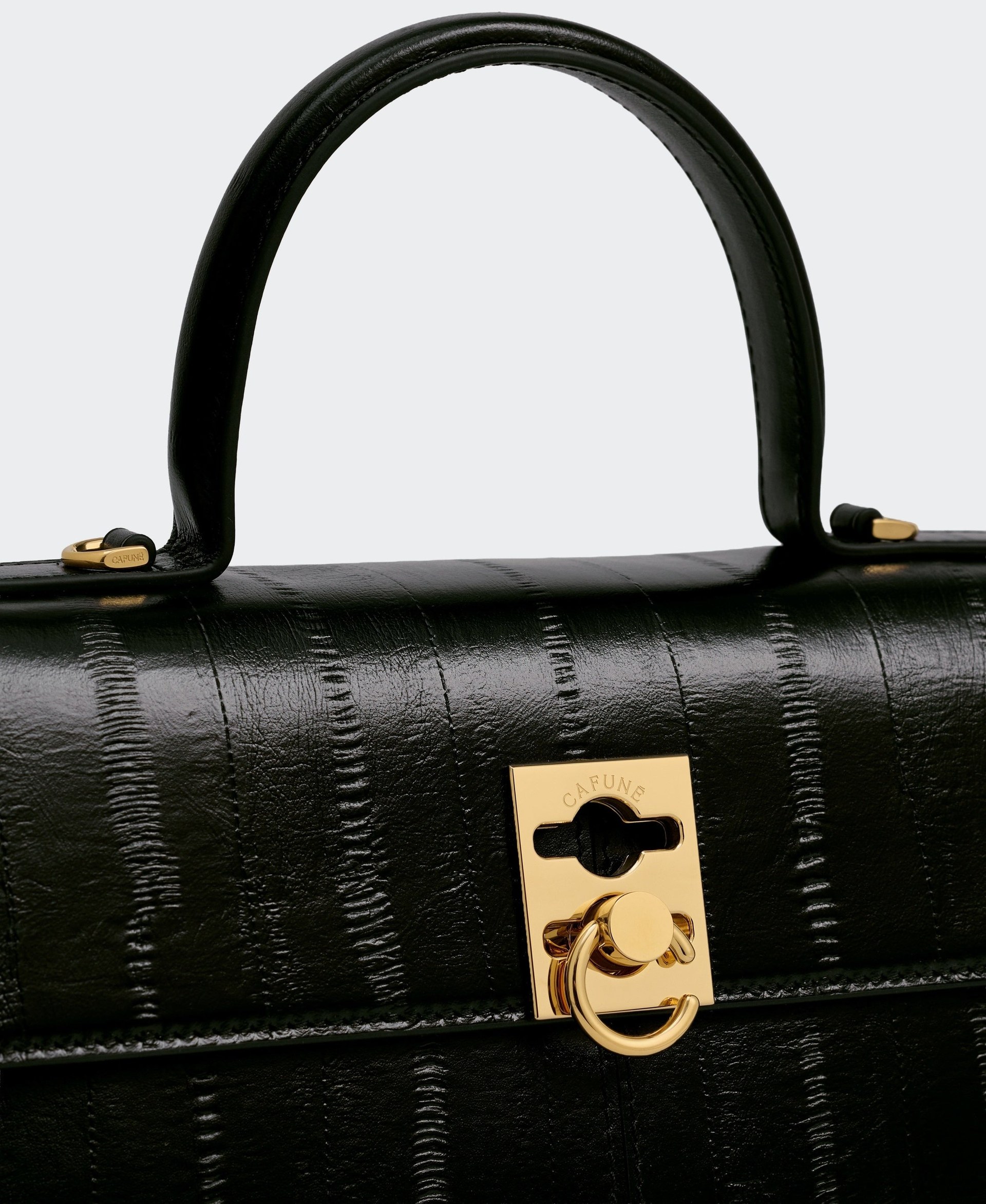 Black calf leather embossed with an eel pattern